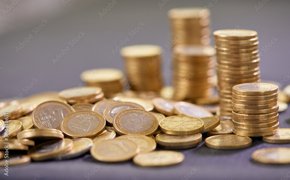Stock Photo - Euro coins. Euro money. Euro currency.Coins stacked on each other in different positions. Money concept Stock Photo - Euro coins. Euro money. Euro currency.Coins stacked on each other in different positions. Money concept