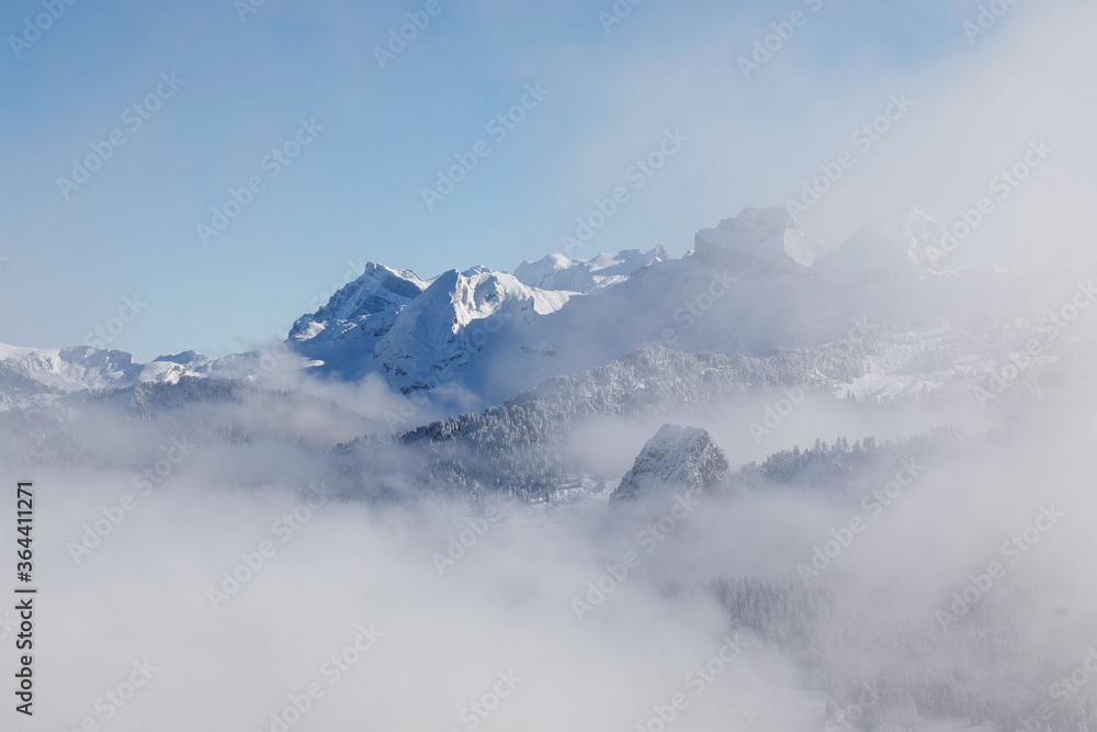 Rising fog with the Alps in the background in Central Switzerland