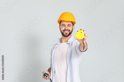Young man with measuring ta...