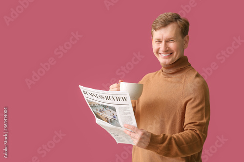 Handsome man with cup of te...