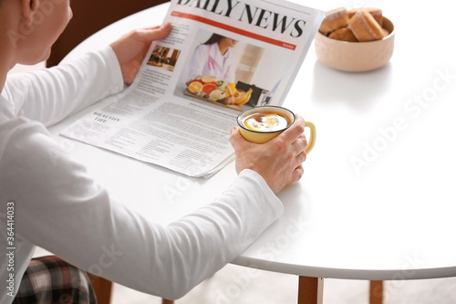Handsome man with newspaper...