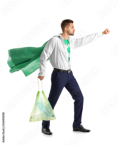 Man dressed as eco superhero with garbage bag on white background