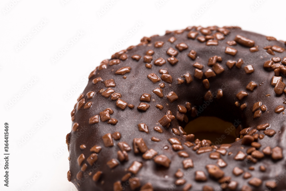 Chocolate donut on a white background close-up. Chocolate donut on a white background close-up.