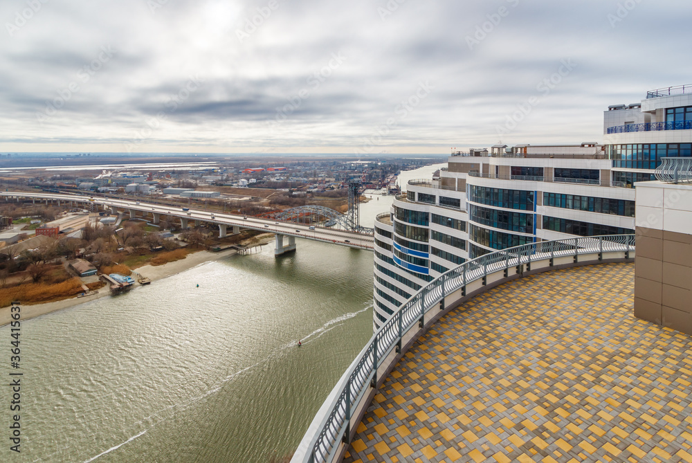 The landscape view from the rooftop of a high-rise building with the river and the road bridge over it. Don river, Rostov-on-Don, Russia