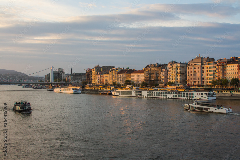 View of the Danube river embankment in Budapest at sunset. Hungary