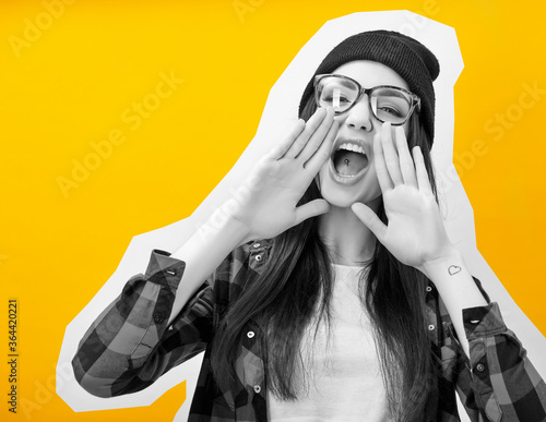 Фотография Girl screaming like in megaphone holding hands near her face with open mouth, collage in magazine style