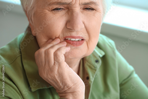 Senior woman suffering from...