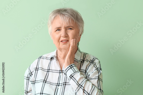 Senior woman suffering from...