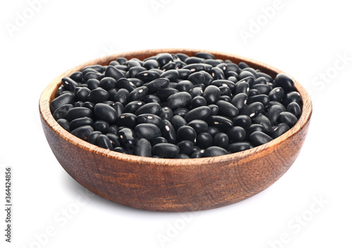 Plate with raw beans on white background