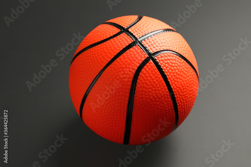 Ball for playing basketball game on dark background © Pixel-Shot