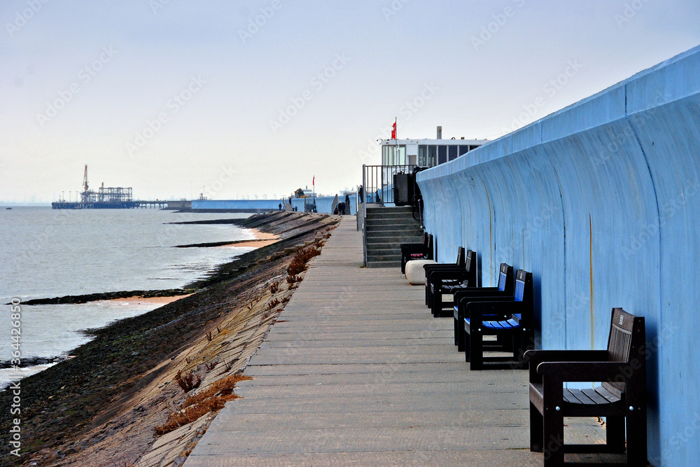 Benches by the sea wall at Concord beach Canvey Island, Essex, England