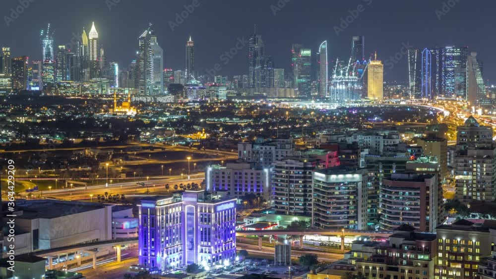 Aerial view of transition from day to night with huge skyscrapers and lights from them in downtown and financial district Timelapse with colorful sky, Dubai, United Arab Emirates Aerial view of transition from day to night with huge skyscrapers and lights from them in downtown and financial district Timelapse with colorful sky, Dubai, United Arab Emirates