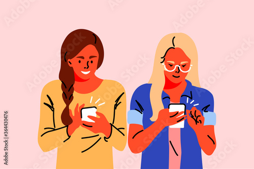 Communication, technology, social media, friendship concept. Women girls teenagers friends chatting together in social network with smartphones. Youth culture modern lifestyle mobile phone addiction.