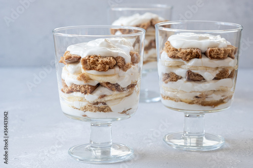 Tableau sur toile Banana caramel parfait trifle desserts with fresh whipped cream and chocolate co