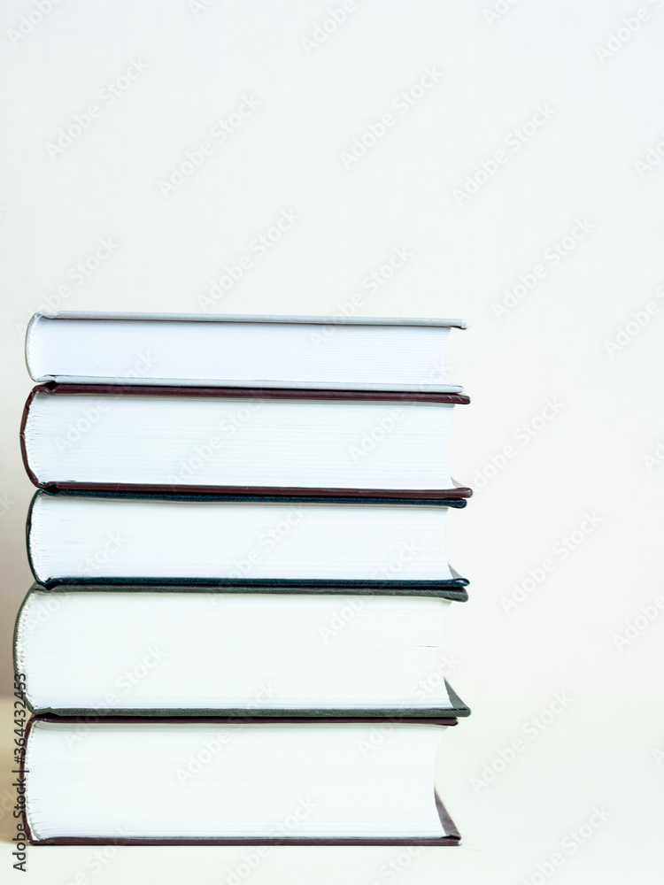 a stack of books on a light background a stack of books on a light background