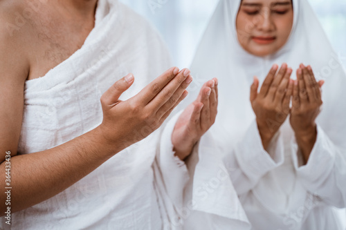close up hand muslim praying open their arm wearing ihram