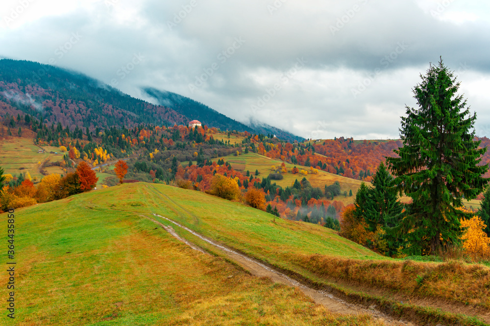 Beautiful autumn landscape in mountain village.