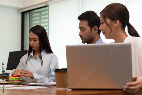 Asian business man and women meeting and talk about job in office.