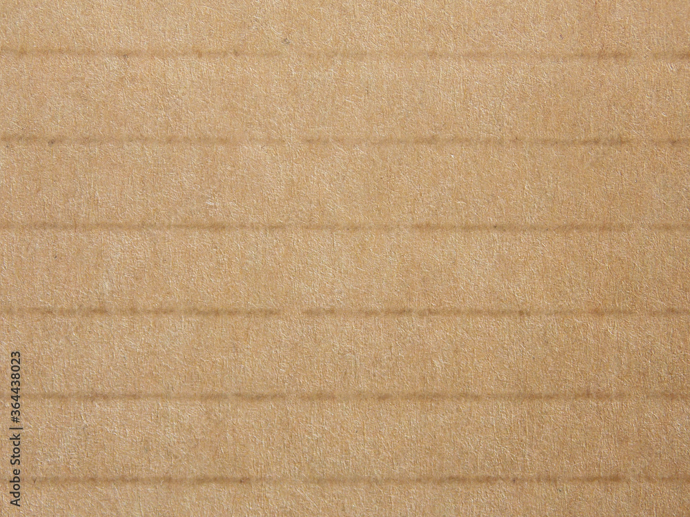 Fototapeta premium Striped cardboard texture background. Brown recycled packaging cardboard with horizontal stripes.