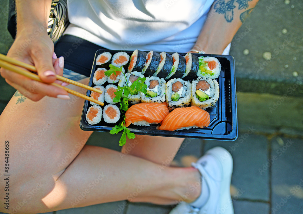 Sushi take away, Sushi to go outdoors. Healthy eating out.