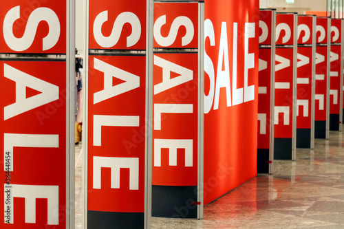Light boards with sale signs on in a store. Concept of shopping, sales, discounts