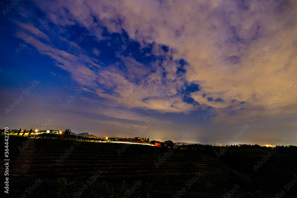 Fototapeta premium Evening in the vineyard of Rosazzo during a moon eclipse