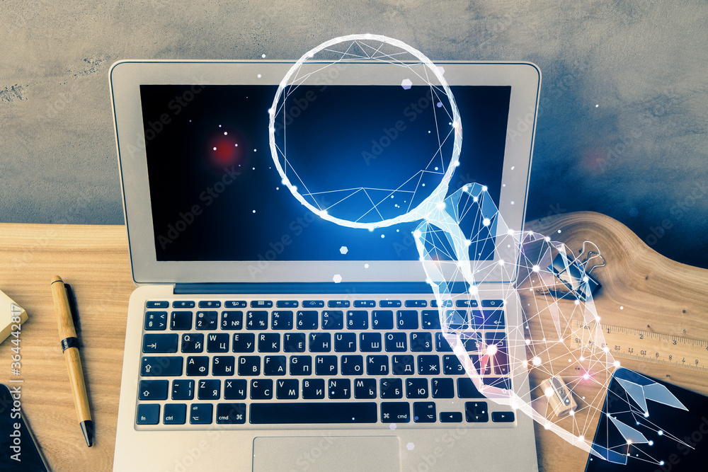 Desktop computer background in office and start up theme hologram drawing. Double exposure. Startup concept. Desktop computer background in office and start up theme hologram drawing. Double exposure. Startup concept.