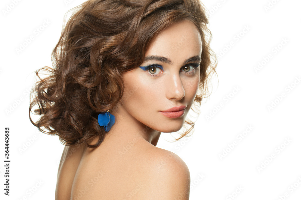 Beautiful woman with clear skin and dark curly hair isolated on white Beautiful woman with clear skin and dark curly hair isolated on white