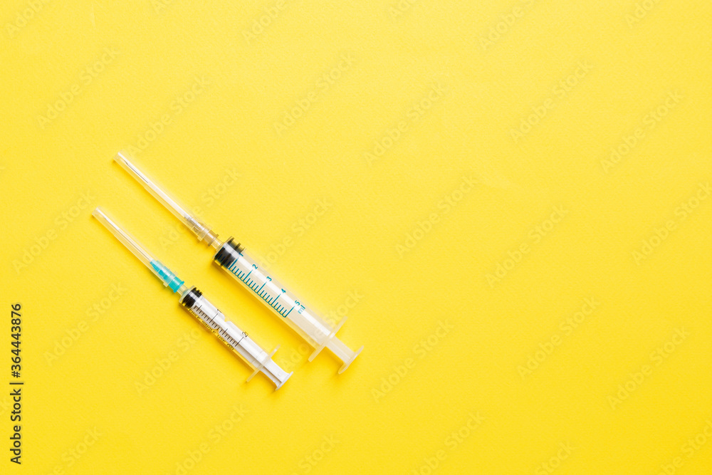 Top view of medical syringes on colorful background. Health care concept with copy space Top view of medical syringes on colorful background. Health care concept with copy space
