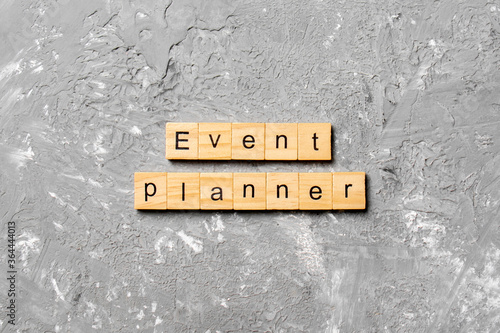 EVENT PLANNER word written on wood block. EVENT PLANNER text on cement table for your desing, concept