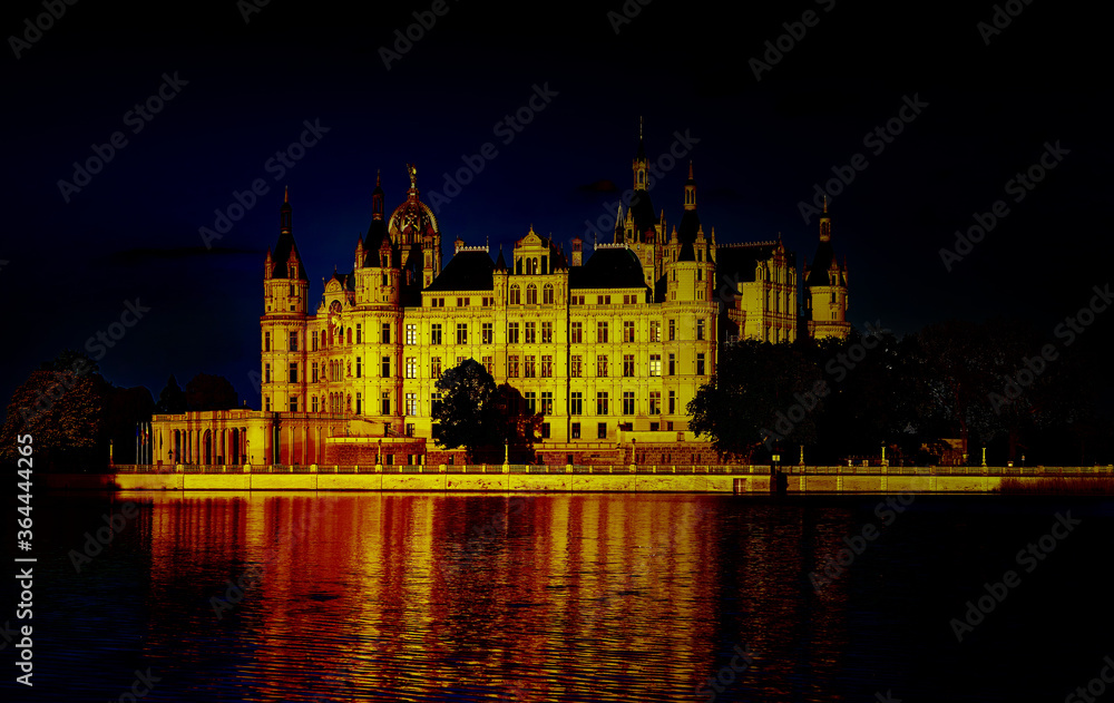 Schwerin Castle illuminated at night. Germany