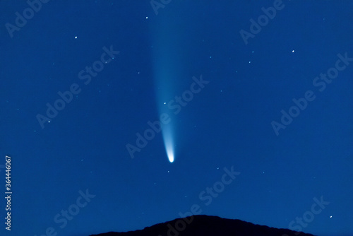 Fototapeta Naklejka Na Ścianę i Meble -  Comet falling in a night sky over a mountain