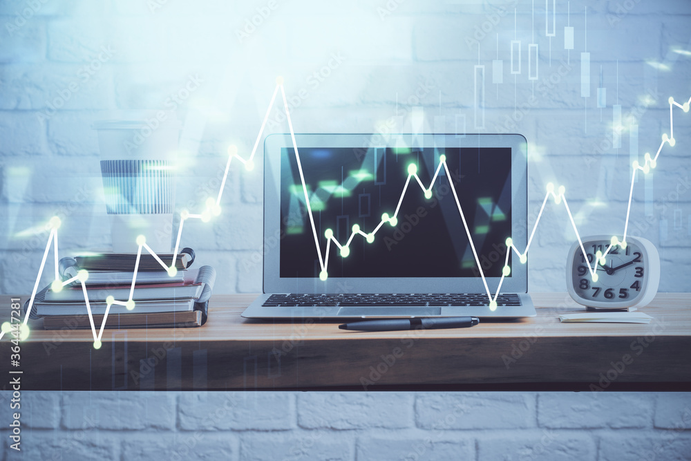 Stock market graph on background with desk and personal computer. Double exposure. Concept of financial analysis. Stock market graph on background with desk and personal computer. Double exposure. Concept of financial analysis.