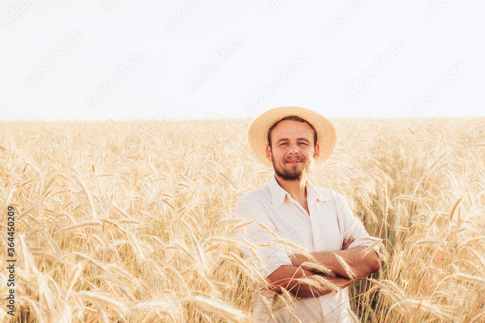 A man in a wheat field. Photo of a farmer in the field. The man in the field of life.