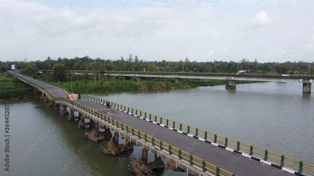 Fototapeta premium Aerial view of Srandakan long bridge that crosses the river Progo. Yogyakarta Indonesia