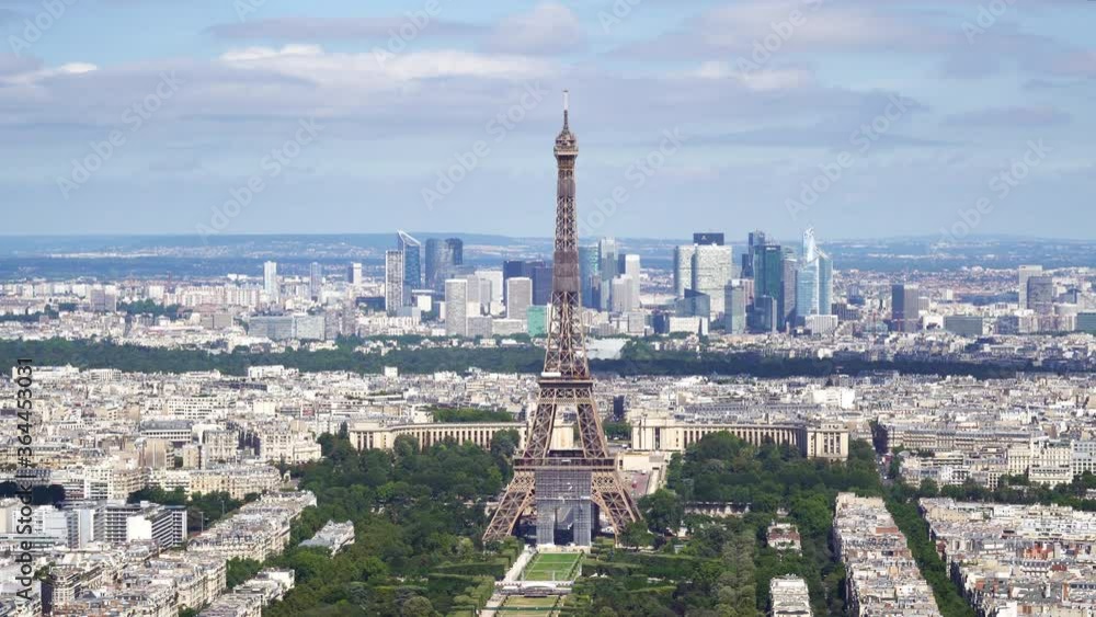 Aerial shot of the Eiffel Tower from Tour Montparnasse observation desk with the Trocadero and La Defense business district in the background - Paris, France Aerial shot of the Eiffel Tower from Tour Montparnasse observation desk with the Trocadero and La Defense business district in the background - Paris, France