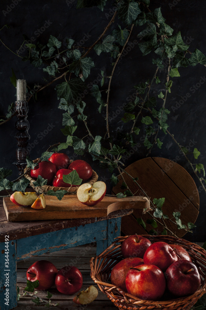 Still life with red apples. The dark style. The vertical format. Still life with red apples. The dark style. The vertical format.
