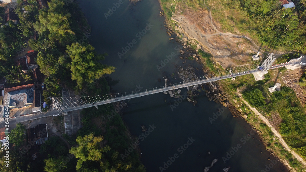 aerial view of a suspension bridge that crosses the Opak river in Bantul. Yogyakarta Indonesia