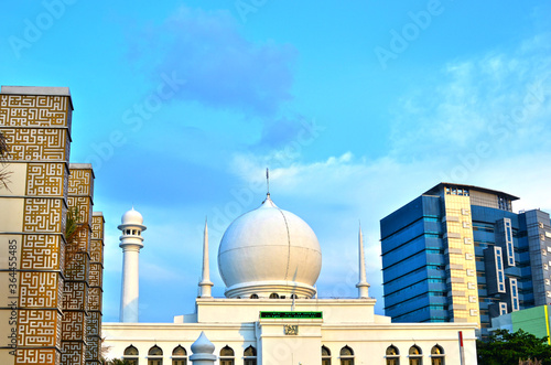 Dome of the mosque in Jakarta, between offices buiding photo