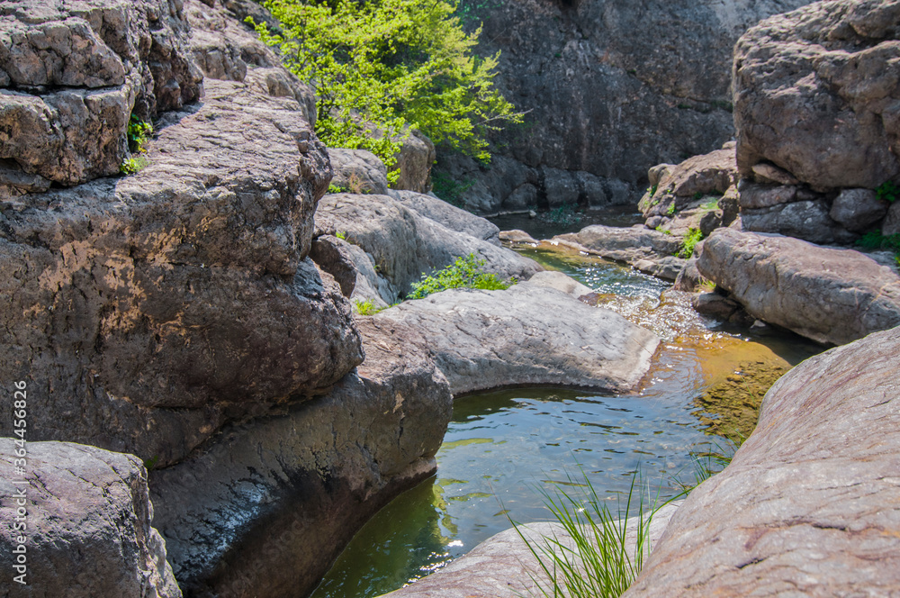 Mountain lake, large stone in foreground Mountain lake, large stone in foreground