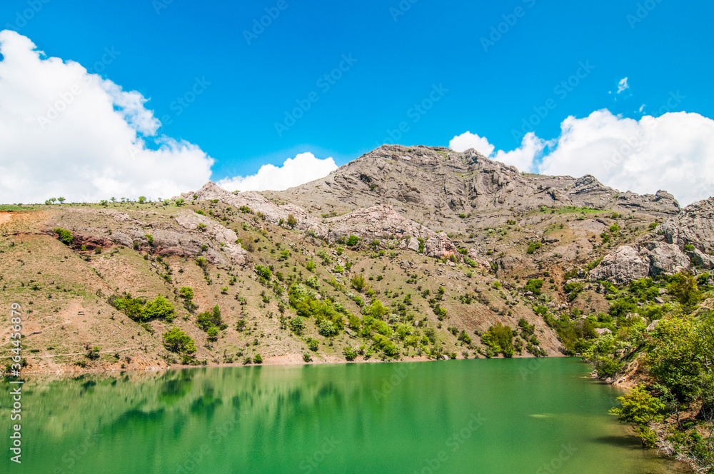 Mountain lake, large stone in foreground