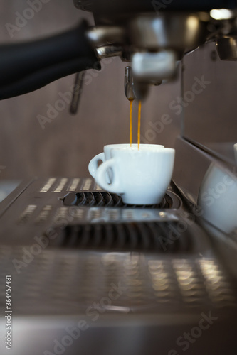 Professional coffee machine pouring espresso. Barista coffee making process.