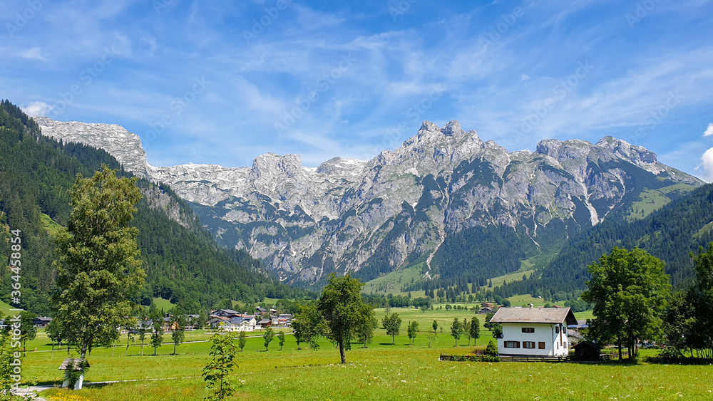 austrian alpine landscape with valley and mountains