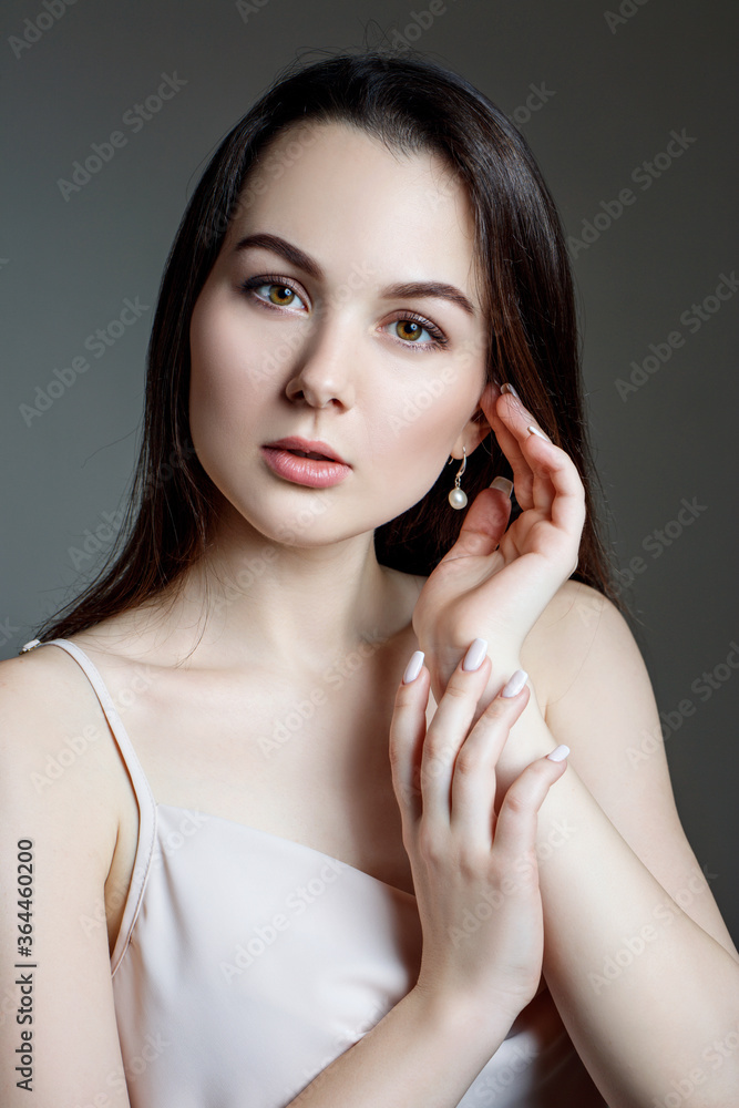 Fototapeta premium Portrait of woman in white blouse and black hair.