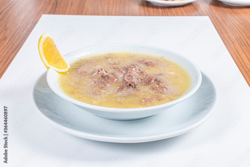 Turkish Traditional Soup with bread on white rustic wooden background, kelle, paca corbasi. Turkish Traditional Soup with bread on white rustic wooden background, kelle, paca corbasi.