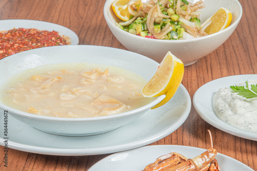 Turkish Traditional Soup with bread on white rustic wooden background, iskembe corbasi. Turkish Traditional Soup with bread on white rustic wooden background, iskembe corbasi.