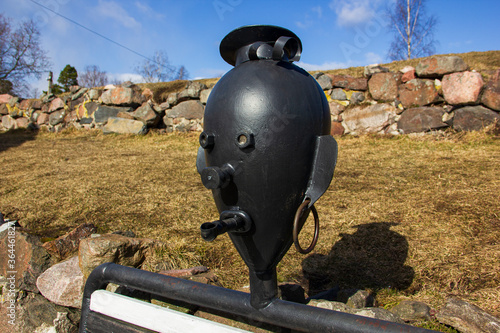 Bench in the form of a sailor inside the stone fortress of Korela in the city of Priozersk. photo