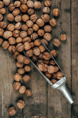 Nuts on an old wooden background. The view from the top. Art.