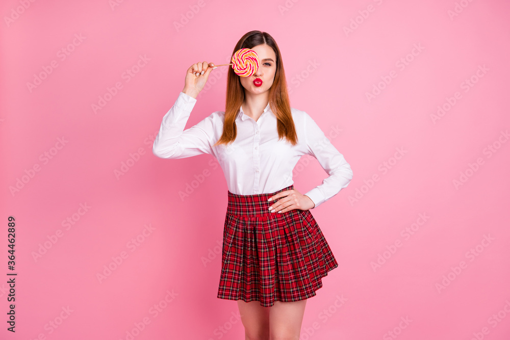 Portrait of her she nice attractive lovely funny flirty cheerful cheery red-haired teen girl closing covering eye lollipop pout lips having fun isolated over pink pastel color background Portrait of her she nice attractive lovely funny flirty cheerful cheery red-haired teen girl closing covering eye lollipop pout lips having fun isolated over pink pastel color background