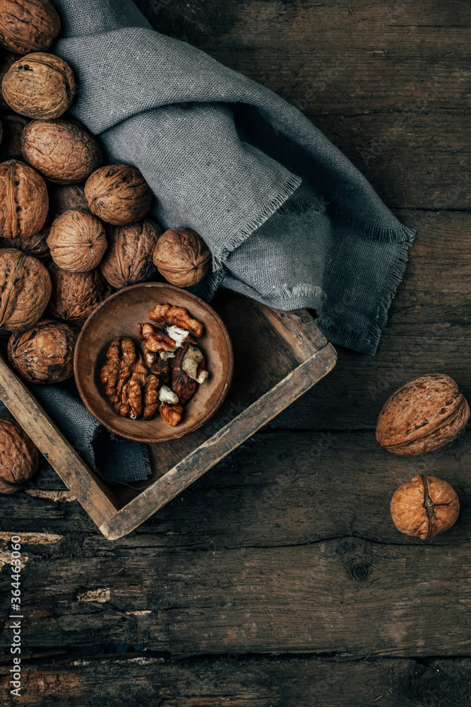 Nuts on an old wooden background. The view from the top. Art.
